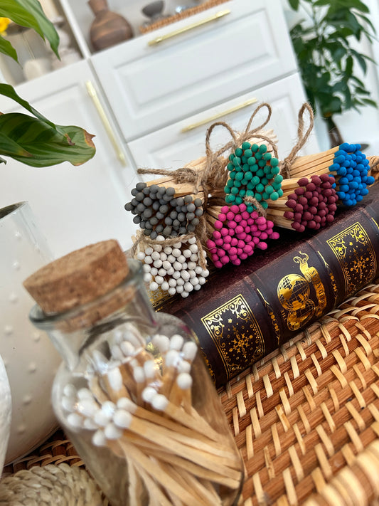 a selection of Coloured matches with different colours, grey, white, pink, green, blue, and brown